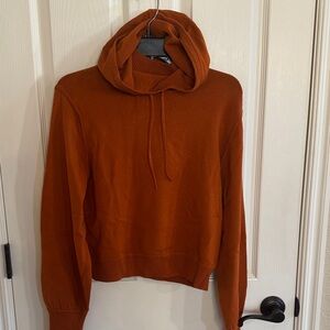 Athleta women’s sweater with hood. Rust color size XS. Like new!